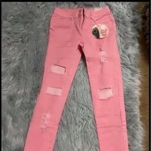 Pink distressed jeans